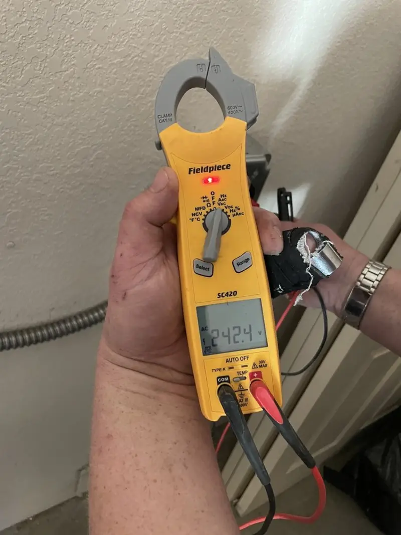 Voltage testing with clamp meter during Whole House Surge Protector in Bessemer